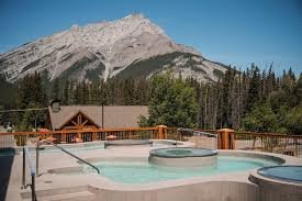Hot tubs with mountain backdrop.