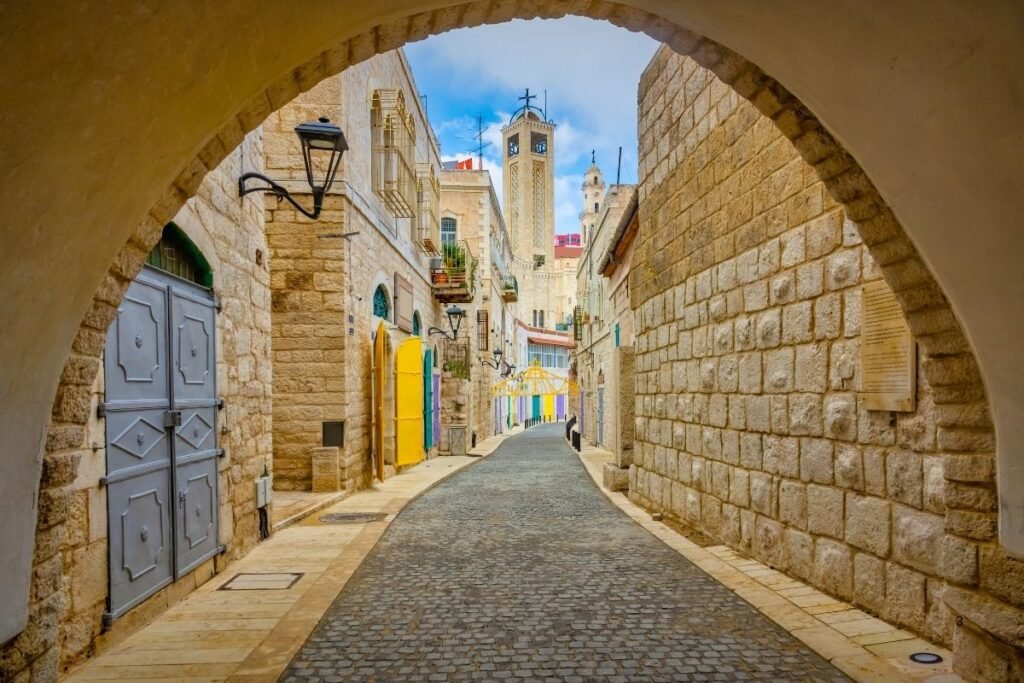 Charming cobblestone street under archway. France